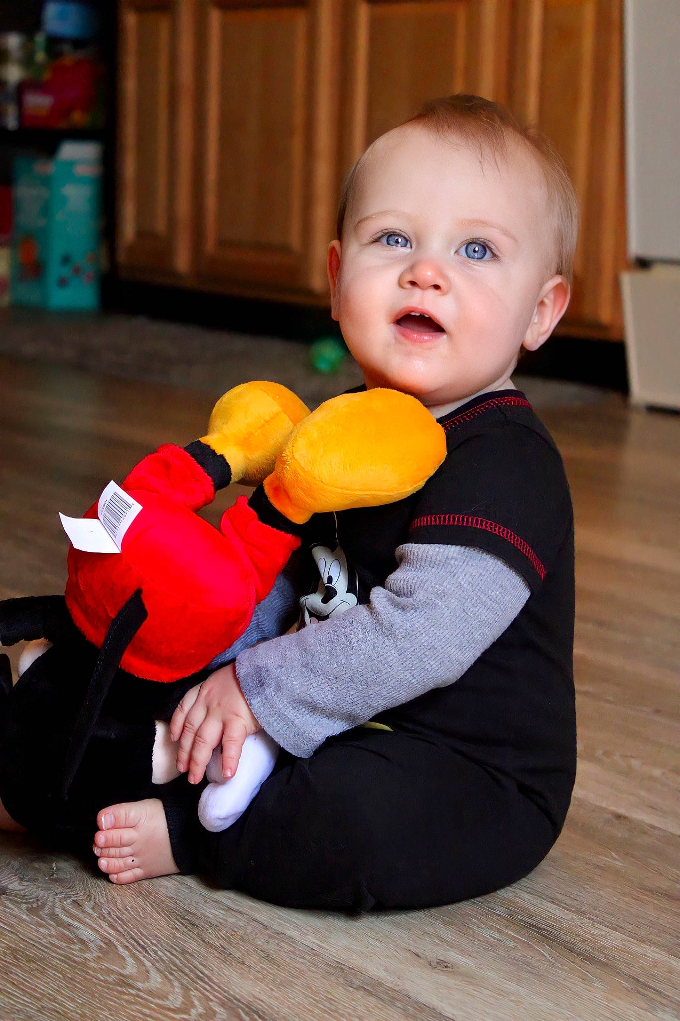 Xzavier is registered to the contest to win money with this photo: baby, baby_playing_with_toys, baby_toddler_clothing, cheek, child, comfort, eye, finger, flooring, fun, happy, hardwood, iris, joint, person, sitting, smile, stuffed_toy, toddler, toy