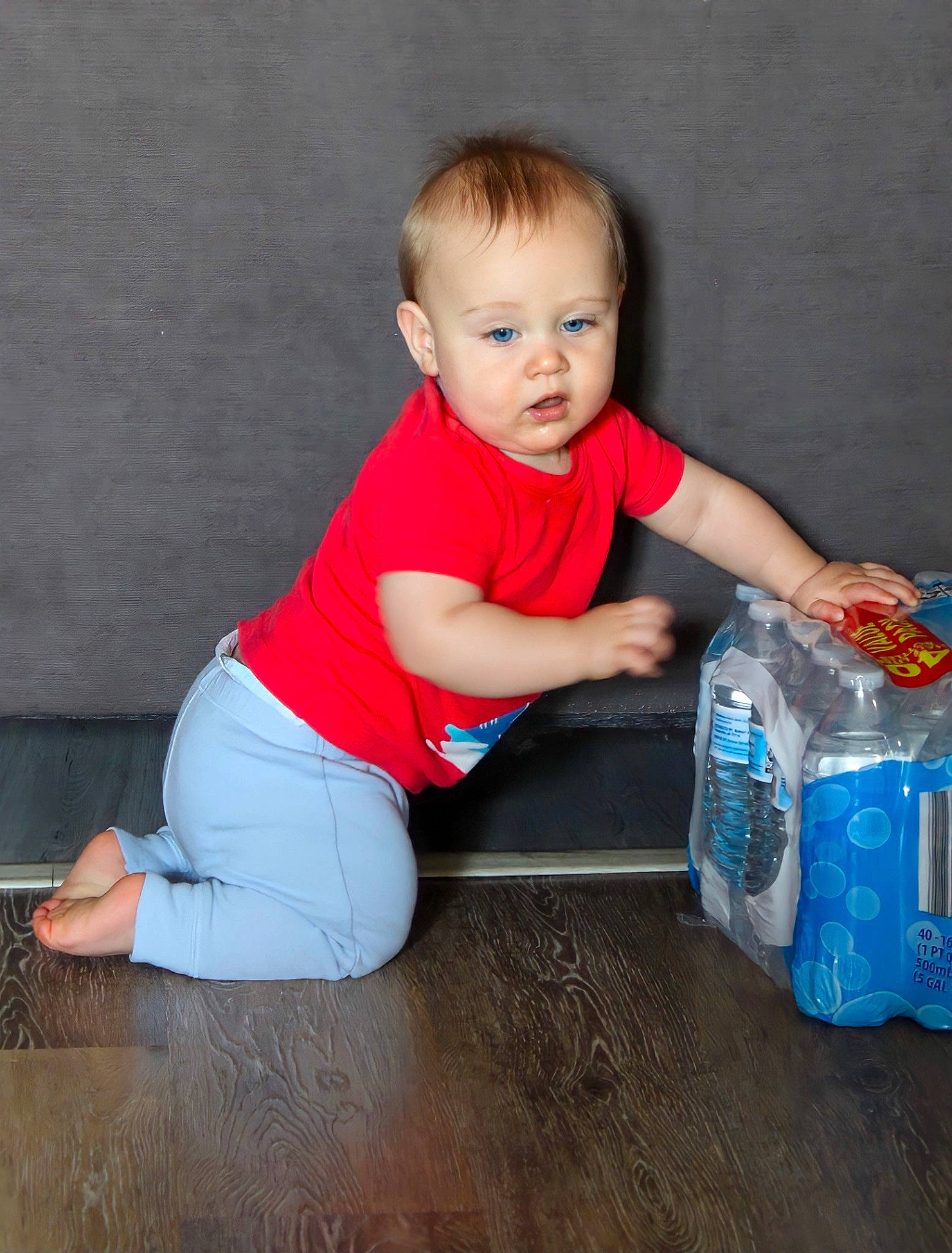 Xzavier is registered to the contest to win money with this photo: baby_toddler_clothing, box, child, electric_blue, flash_photography, flooring, fun, hardwood, human_leg, knee, packaging_and_labeling, person, plastic_bag, plastic_bottle, sitting, skin, sleeve, standing, toddler, varnish