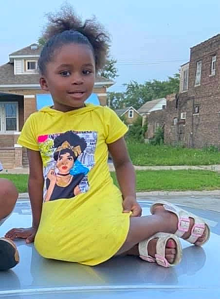 Lyrica joined the competition — help win amazing prizes! baby_toddler_clothing, building, child, event, fun, grass, happy, human_leg, leisure, person, plant, recreation, sandal, shorts, sitting, sky, t_shirt, toddler, tree, vacation