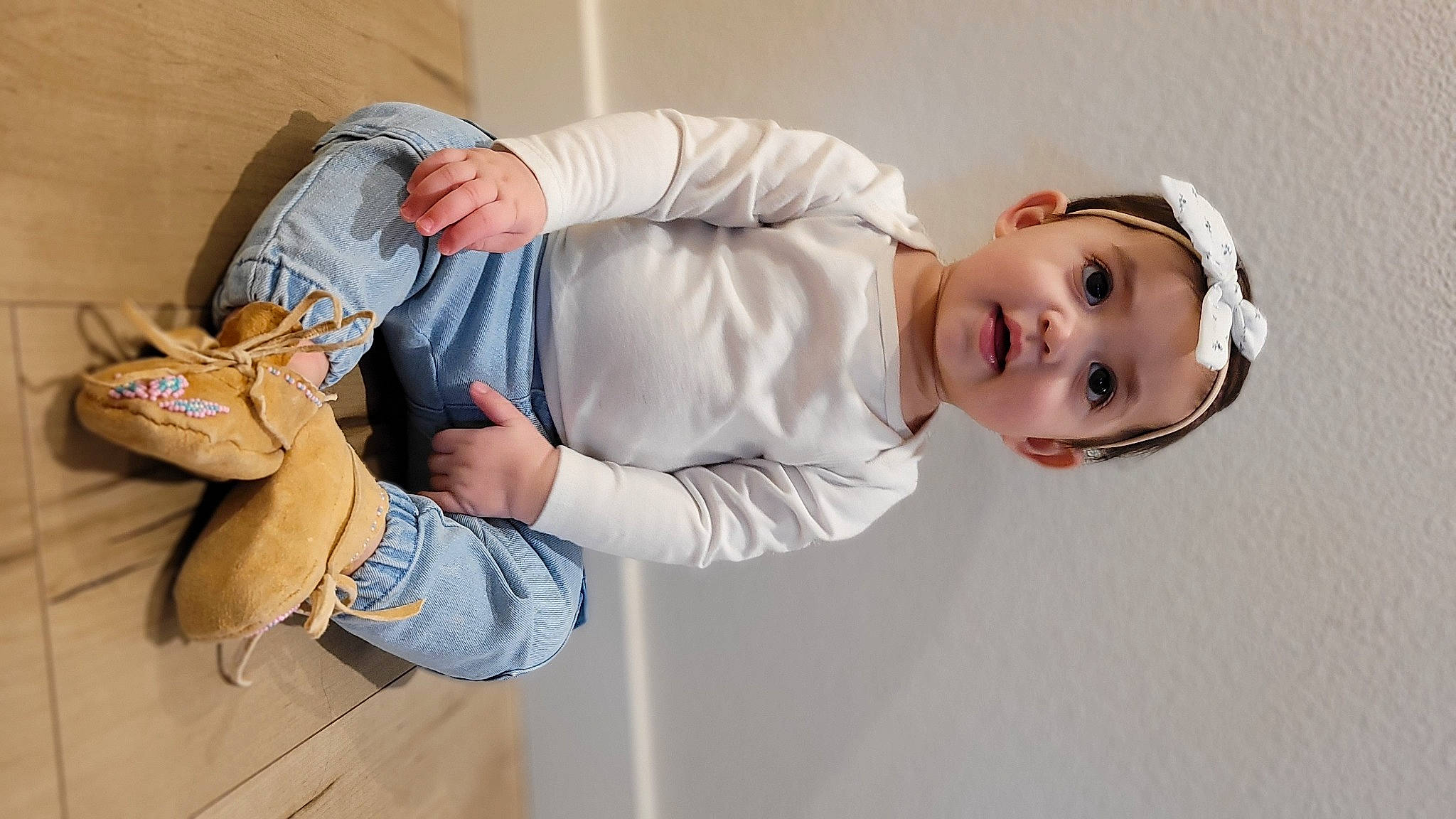 Lola joined the competition — help win amazing prizes! arm, baby, baseball_glove, child, comfort, elbow, finger, gesture, hand, happy, headwear, human_body, human_leg, joint, outerwear, person, sitting, sleeve, sneakers, toddler