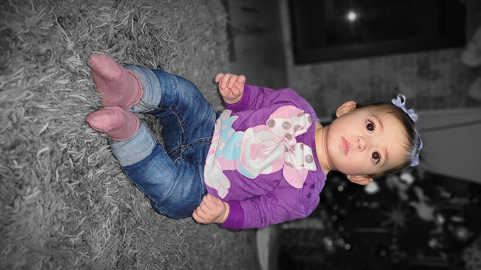 Lola is registered to the contest to win money with this photo: arm, baby, baby_toddler_clothing, cheek, child, flash_photography, foot, fun, gesture, grass, happy, human_leg, person, purple, sitting, skin, textile, thigh, thumb, toddler