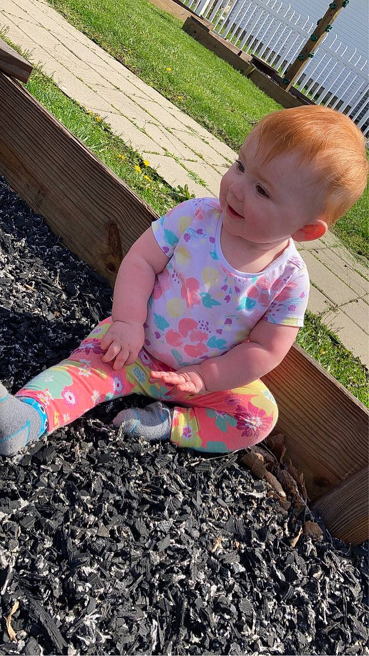 Khaleesia is registered to the contest to win money with this photo: asphalt, baby, baby_toddler_clothing, child, fun, garden, grass, happy, lawn, leisure, people_in_nature, person, pink, play, public_space, recreation, sitting, smile, soil, t_shirt