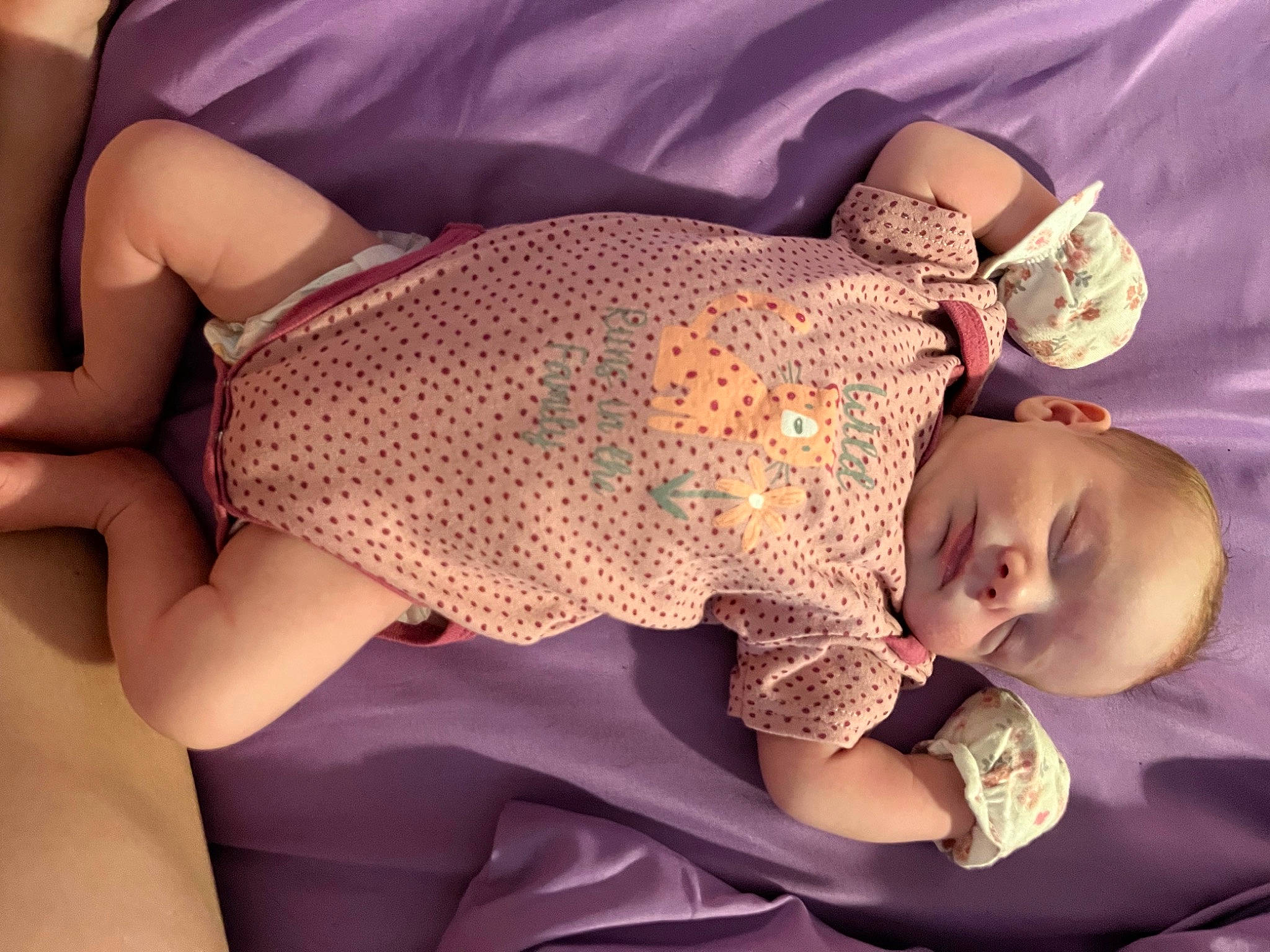 Ariella is registered to the contest to win money with this photo: baby, baby_sleeping, baby_toddler_clothing, chest, comfort, finger, hand, headgear, human_body, joint, leg, neck, pattern, person, pink, skin, sleeve, thigh, toddler, trunk