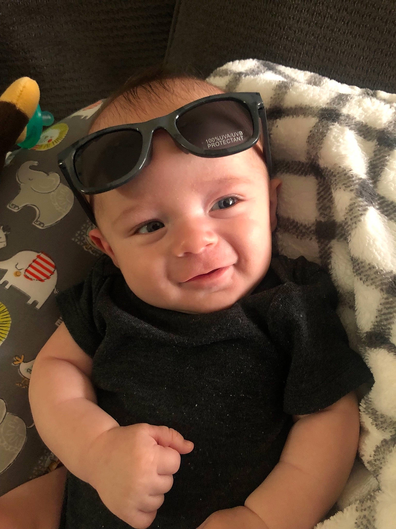 Cash is registered to the contest to win money with this photo: baby, cheek, child, cool, eye, eyewear, glasses, hat, head, headgear, joy, lip, person, personal_protective_equipment, skin, smile, sunglasses, toddler, vision_care