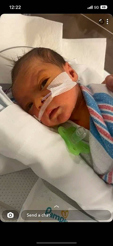 Hardin is registered to the contest to win money with this photo: baby, baby_products, baby_safety, baby_toddler_clothing, cheek, child, childbirth, comfort, eyelash, hospital, linens, medical_equipment, mouth, nose, person, personal_protective_equipment, room, service, skin, thumb