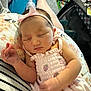 Everleigh joined the competition — help win amazing prizes! baby, sleeping, pink_dress, headband, bow, pillow, striped_shirt, hand, face, infant, cute, resting, indoor, child, person, furniture, toy, home, comfort, peaceful