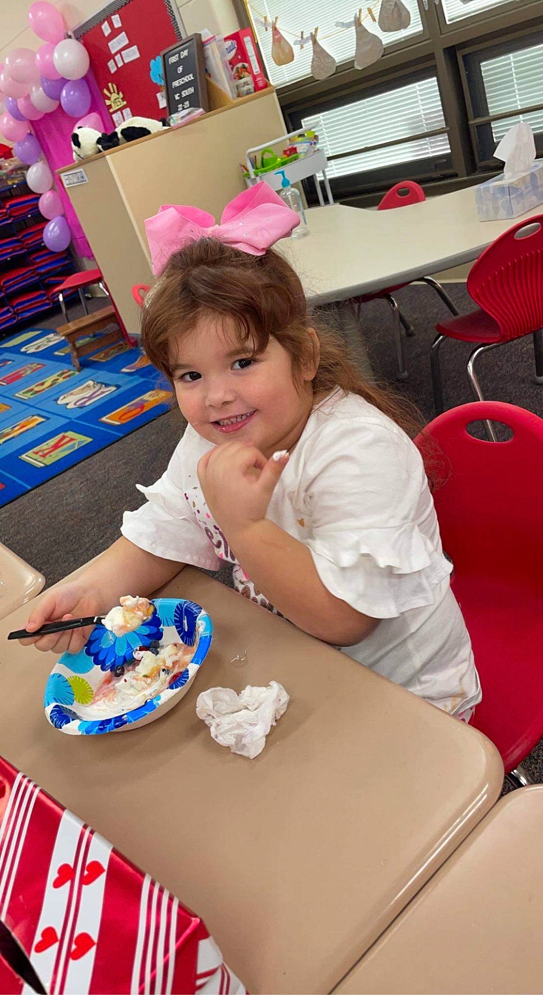 Kimberlee is registered to the contest to win money with this photo: birthday, birthday_cake, chair, child, desk, dessert, event, food, fun, icing, joy, leisure, party, person, plate, recreation, sitting, smile, sweetness, t_shirt