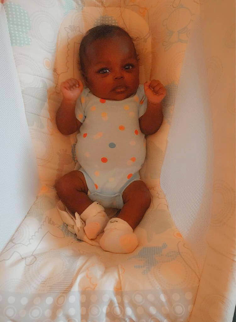 Aleigha is registered to the contest to win money with this photo: abdomen, baby, baby_products, baby_toddler_clothing, barefoot, cheek, chest, child, comfort, finger, foot, linens, person, room, sitting, skin, stomach, textile, thumb, toddler