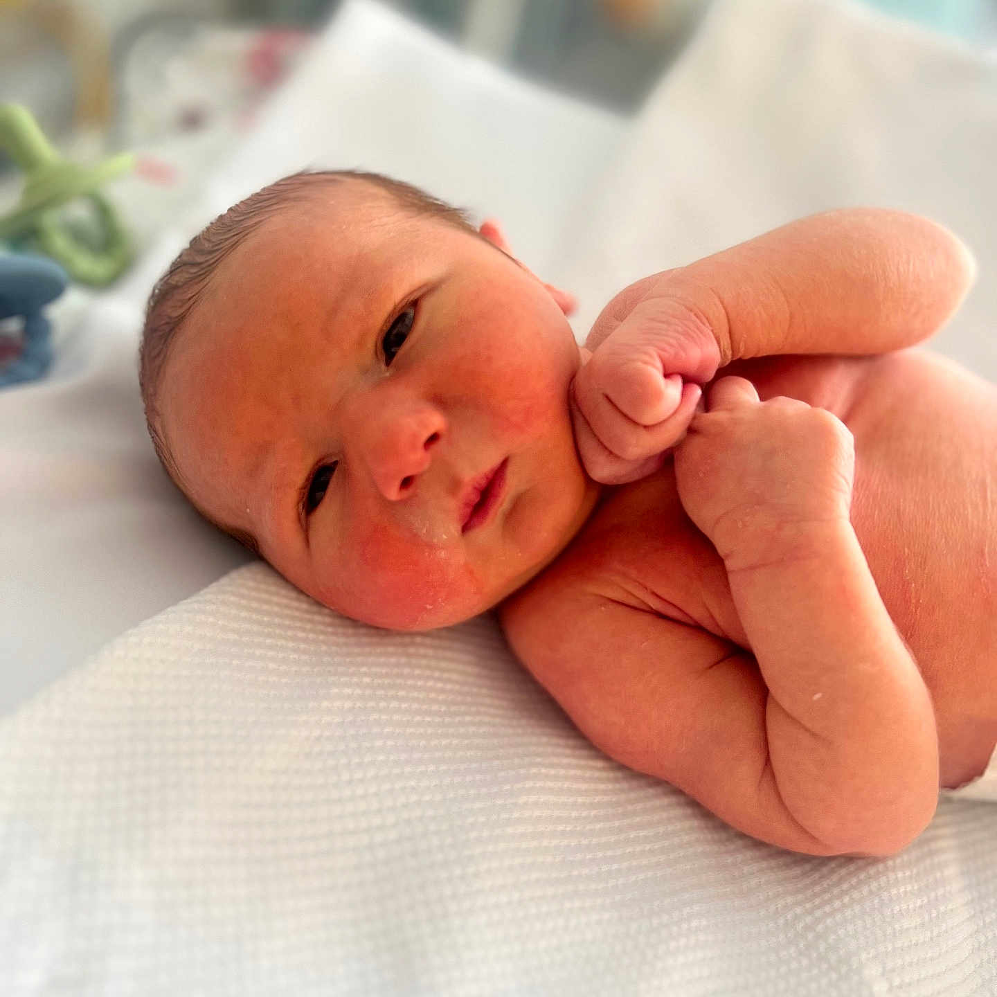 Hunter is registered to the contest to win money with this photo: architecture, baby, bed, blanket, bodypart, building, clothing, face, finger, furniture, glove, hand, head, hospital, newborn, person, photography, portrait, sleeping, wrist