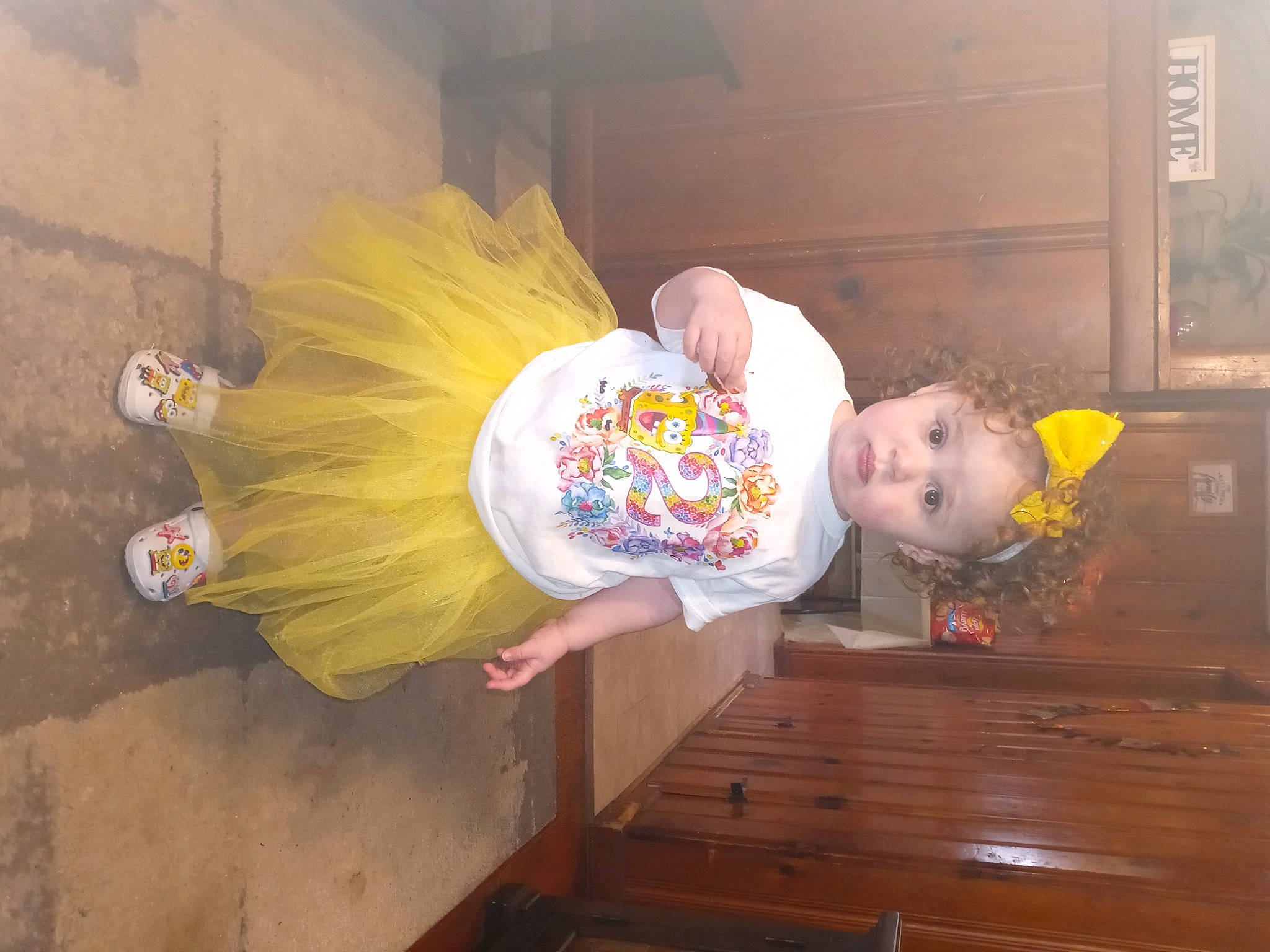 Evolet is registered to the contest to win money with this photo: baby, baby_toddler_clothing, child, costume, flooring, fun, happy, hardwood, orange, person, room, toddler, varnish, wood, wood_stain