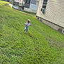 Drake joined the competition — help win amazing prizes! air_conditioner, barefoot, child, clouds, curious, daytime, grass, greenery, house, lawn, mobile_home, nature, outdoor, residential, sky, toddler, trees, walking, window, yard