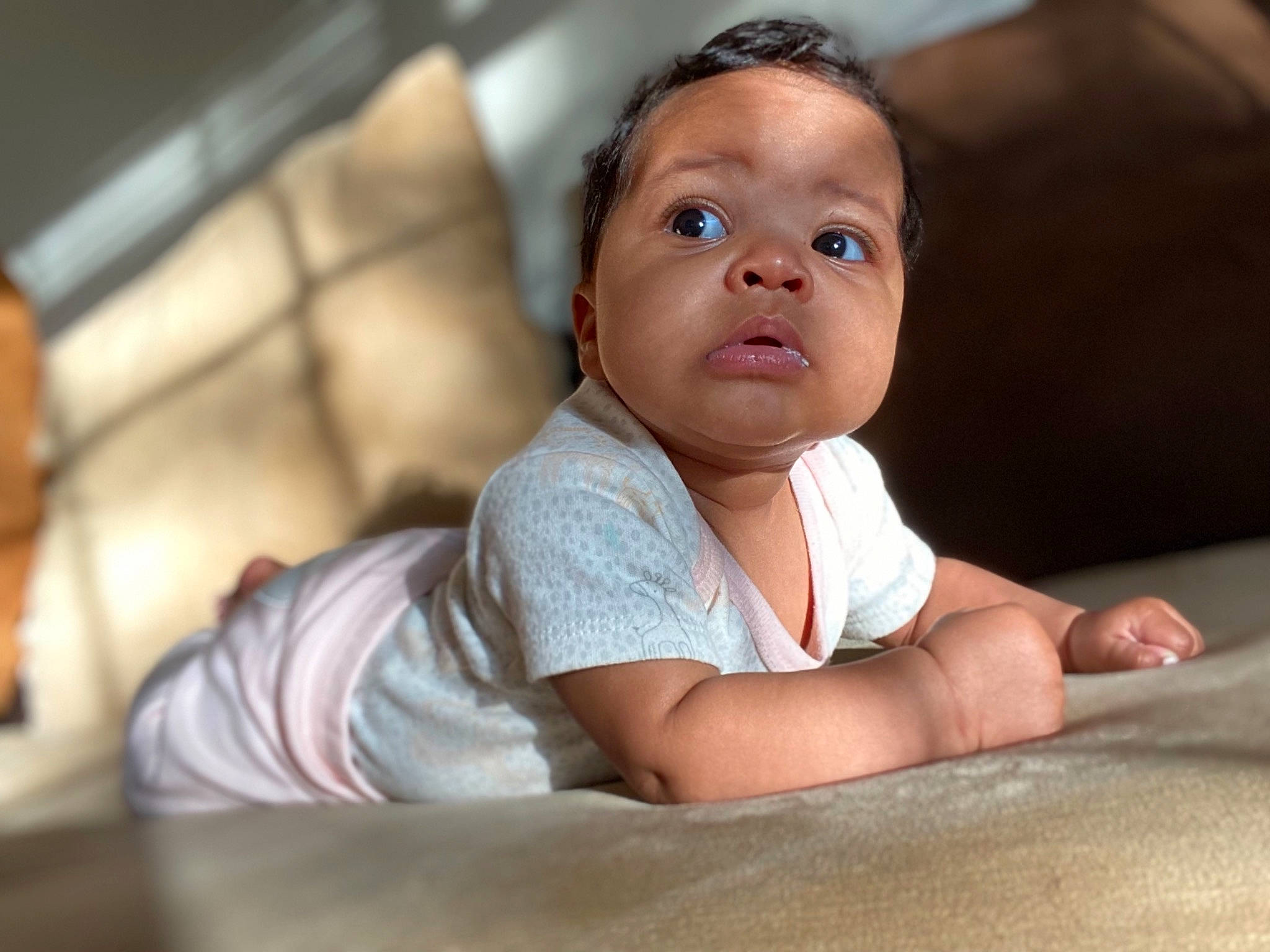 Olivia is registered to the contest to win money with this photo: baby, baby_toddler_clothing, cheek, child, chin, close_up, comfort, elbow, flash_photography, flooring, fun, happy, iris, leisure, mouth, nose, person, sitting, skin, sunglasses