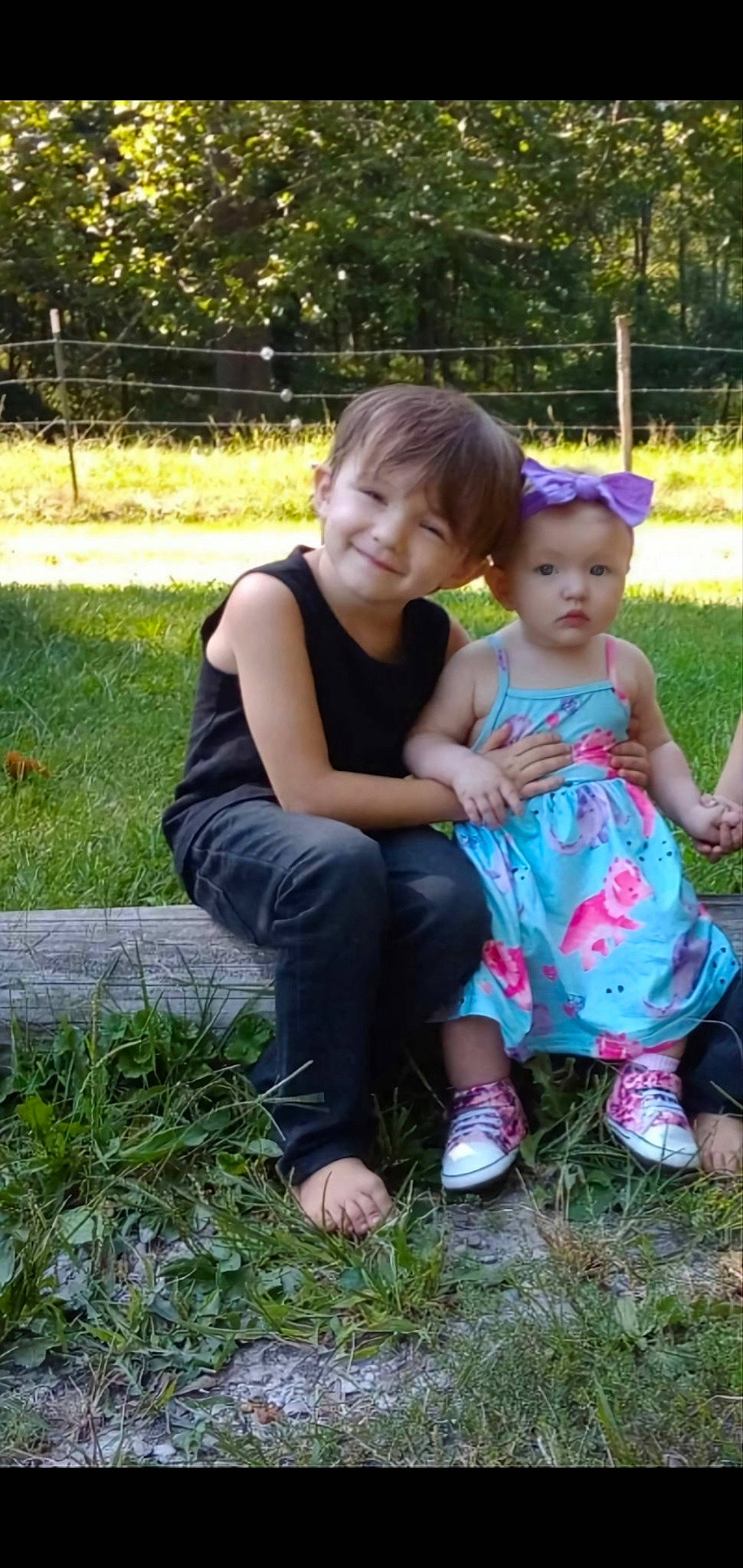 Tyler is registered to the contest to win money with this photo: baby_toddler_clothing, child, event, footwear, fun, garden, grass, grass_family, happy, joy, lawn, leisure, people_in_nature, person, plant, recreation, sitting, smile, sneakers, t_shirt