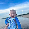 Beckett is registered to the contest to win money with this photo: baby, beach, blue_sky, child, cute, hands, happy, infant, joy, nature, outdoor, person, playful, sky, smile, summer, sunlight, swimsuit, vacation, water