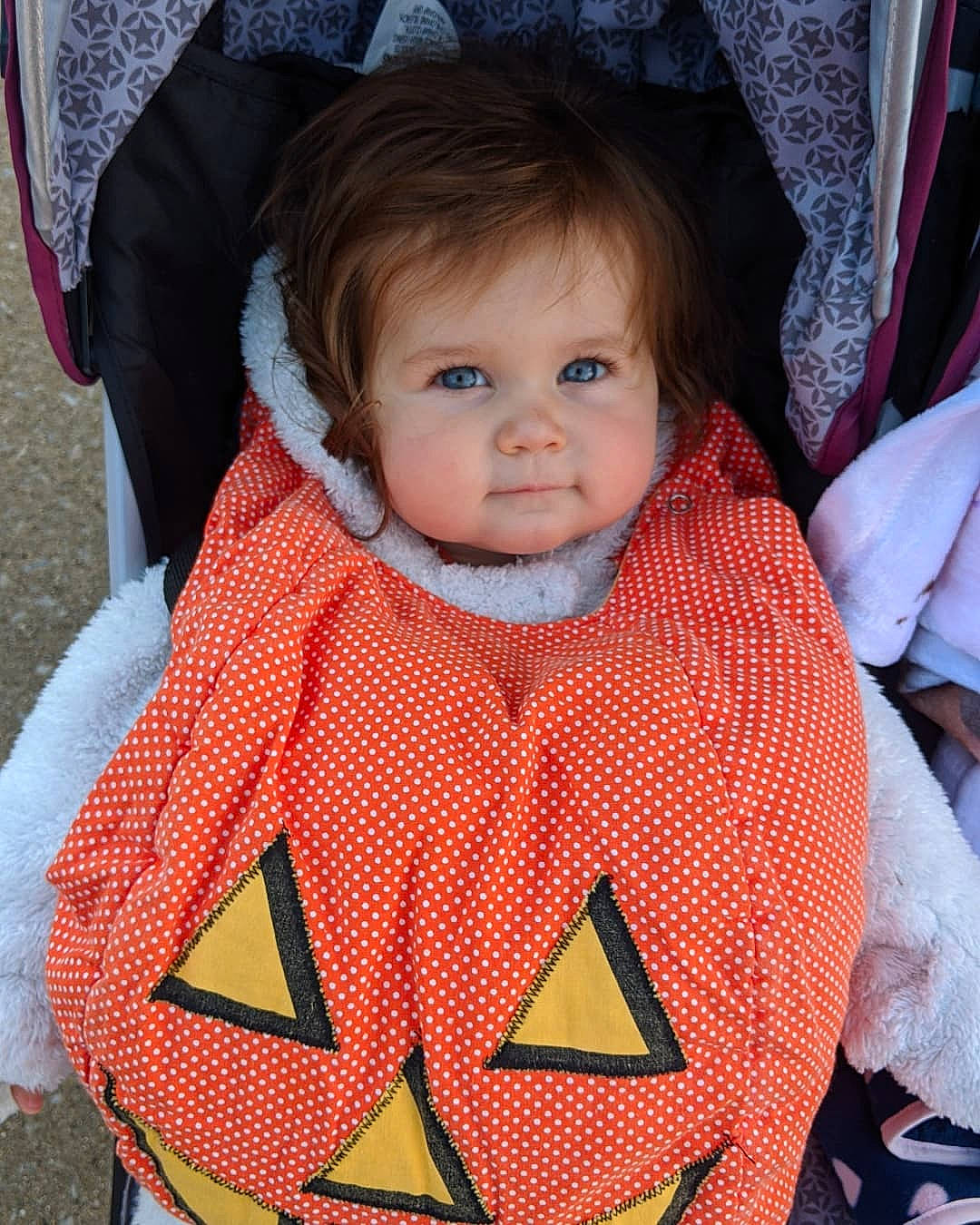 Emmaline joined the competition — help win amazing prizes! baby, baby_carriage, baby_products, baby_toddler_clothing, bib, cheek, cool, eye, face, facial_expression, head, headgear, organ, outerwear, person, pink, red, skin, sleeve, textile