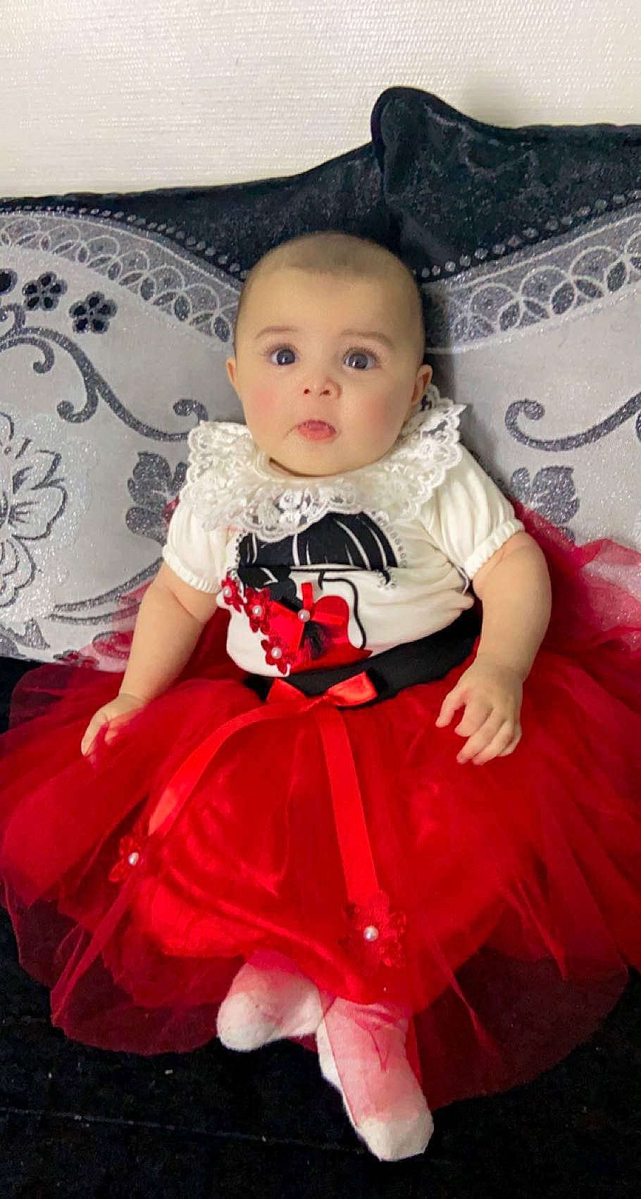 Lina participe au concours pour gagner de l'argent avec cette photo : baby_toddler_clothing, child, costume, day_dress, embellishment, event, fashion_accessory, fashion_design, formal_wear, magenta, one_piece_garment, organ, pattern, person, pink, product, ruffle, sitting, skin, sleeve