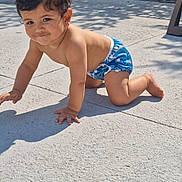 Adam joined the competition — help win amazing prizes! baby, barefoot, child, concrete, crawling, daylight, fence, greenery, happy, outdoor, person, playful, portrait, shadow, smile, summer, sunlight, swim_diaper, toddler, young_child