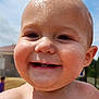 baby, child, smiling, face, water_droplets, head, outdoor, sunlight, skin, expression, happy, closeup, portrait, cheeks, eyes, mouth, teeth, nature, daylight, background