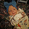 Murphy-Dean joined the competition — help win amazing prizes! baby, infant, child, portrait, face, headband, bow, blue, blanket, swaddled, clothing, patterned, animals, colorful, indoors, cozy, lying_down, looking_at_camera, photography, smiling