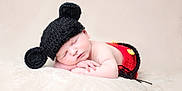 Thyméo participe au concours pour gagner de l'argent avec cette photo : baby, sleeping, hat, knit, ears, red_pants, soft_blanket, peaceful, infant, cute, resting, portrait, cozy, child, newborn, closeup, relaxing, adorable, warm, indoor