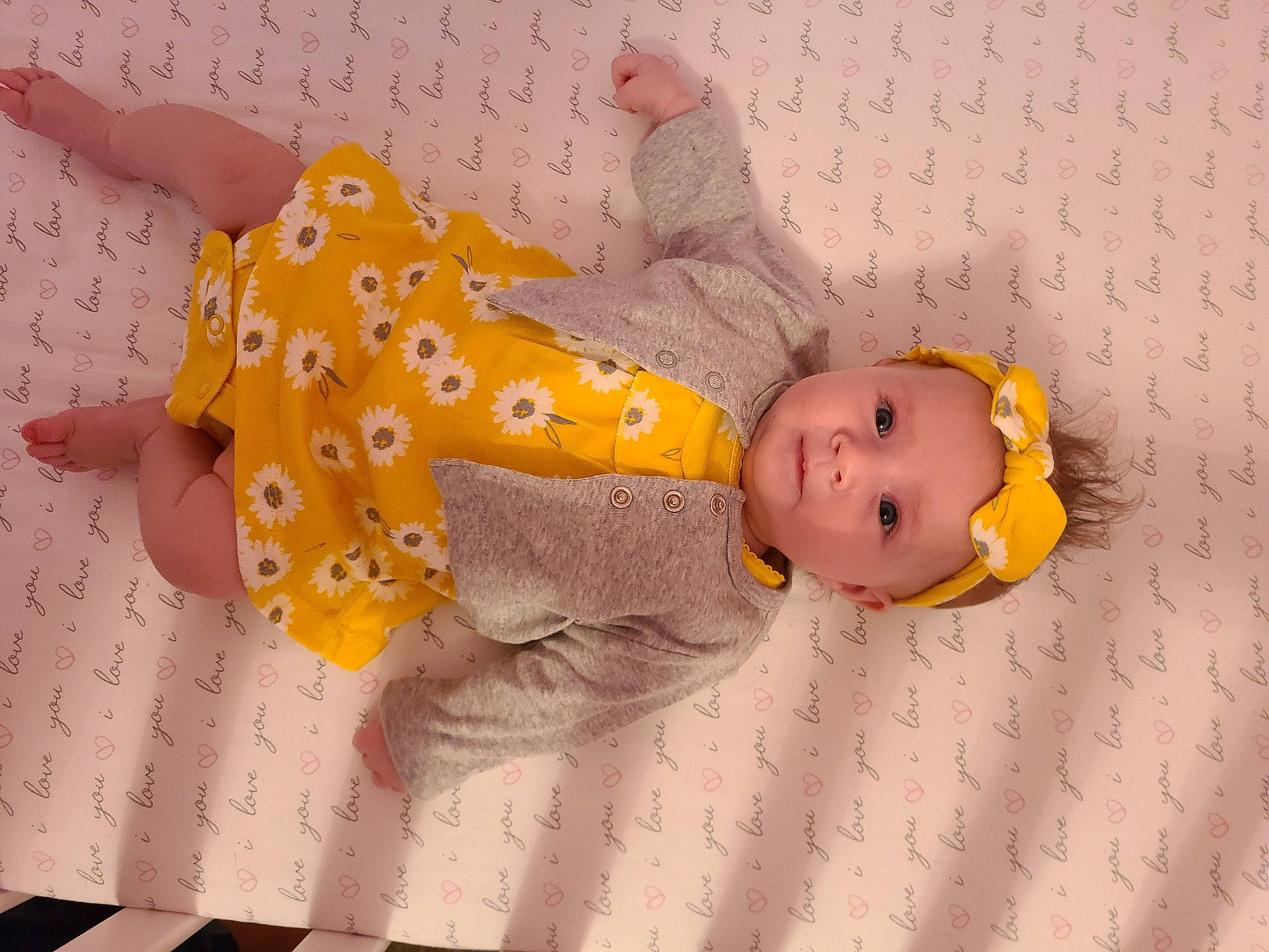 Caydence is registered to the contest to win money with this photo: baby, baby_products, baby_safety, baby_sleeping, baby_toddler_clothing, baby_toys, child, comfort, facial_expression, linens, orange, pattern, person, pink, product, room, skin, textile, toddler, toy