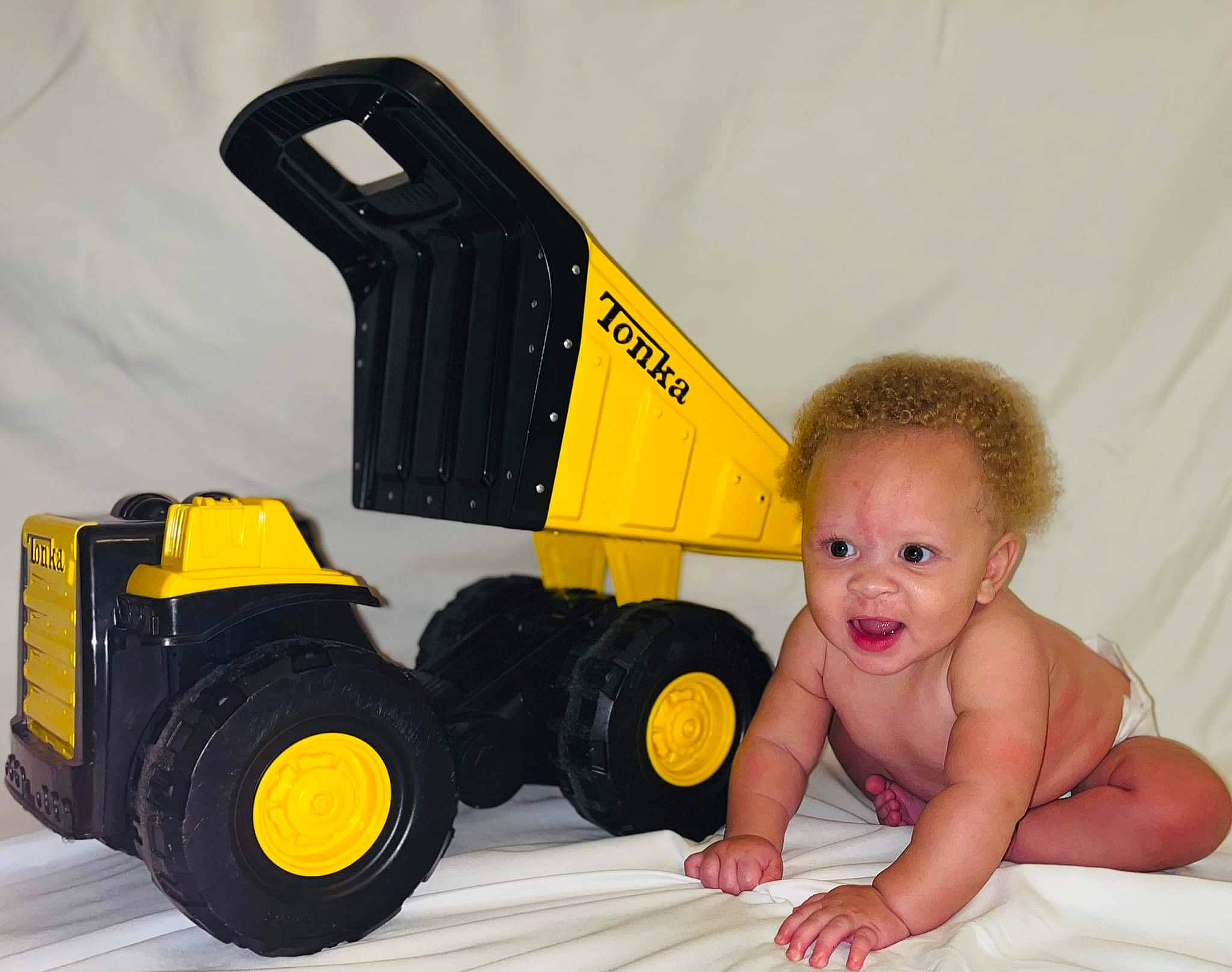 Ahmir joined the competition — help win amazing prizes! automotive_design, automotive_exterior, automotive_tire, automotive_wheel_system, baby, baby_toddler_clothing, child, flooring, happy, motor_vehicle, person, plastic, rolling, smile, tire, toddler, toy, toy_vehicle, tread, wheel