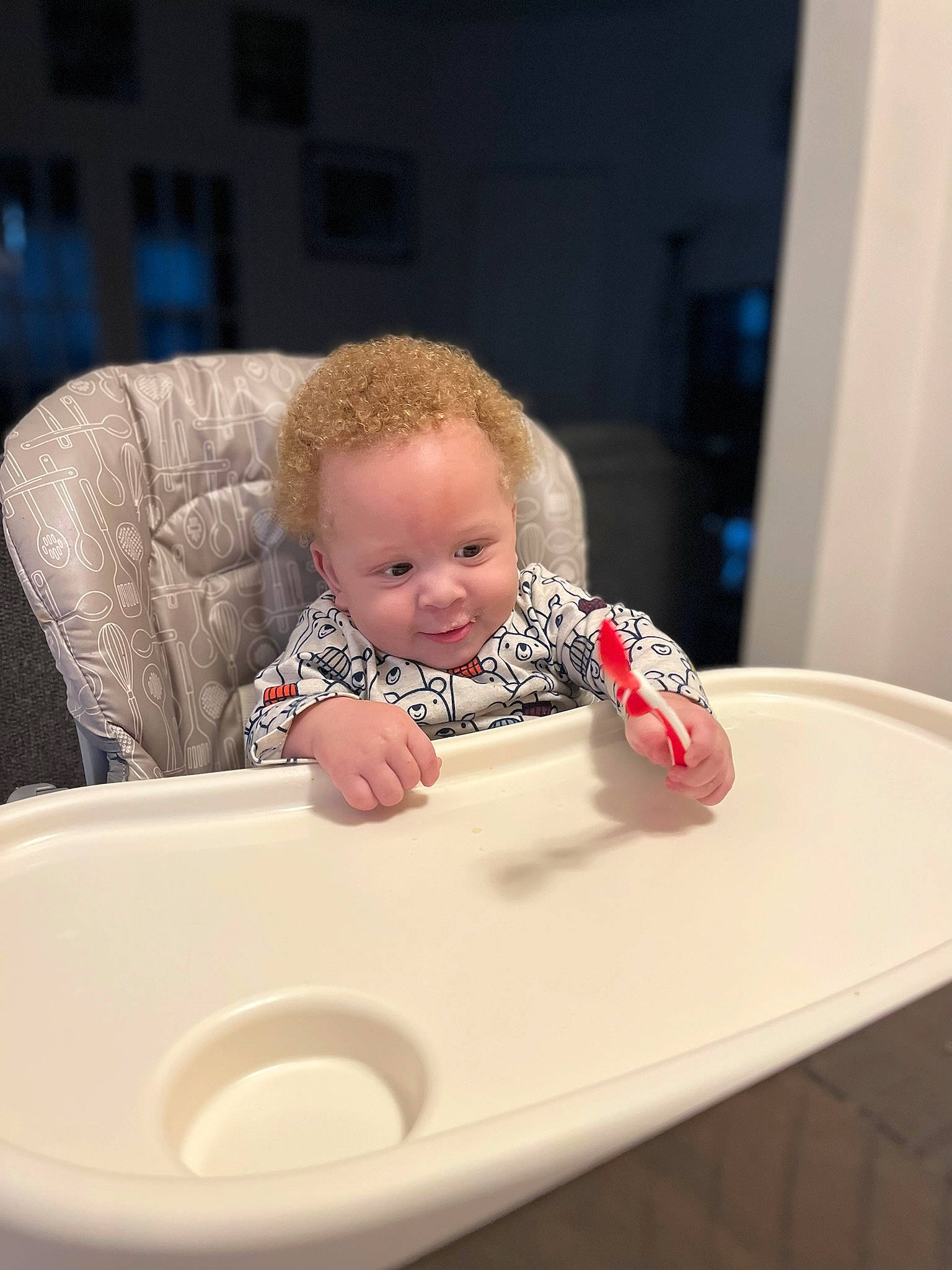 Ahmir is registered to the contest to win money with this photo: baby, baby_toddler_clothing, bib, chair, cheek, child, comfort, dishware, flooring, fun, person, plate, rectangle, room, serveware, sitting, sleeve, smile, table, toddler