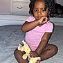 bodypart, cabinet, child, couch, face, female, finger, furniture, girl, hand, happy, head, indoors, person, photography, plush, portrait, sitting, smile, toy
