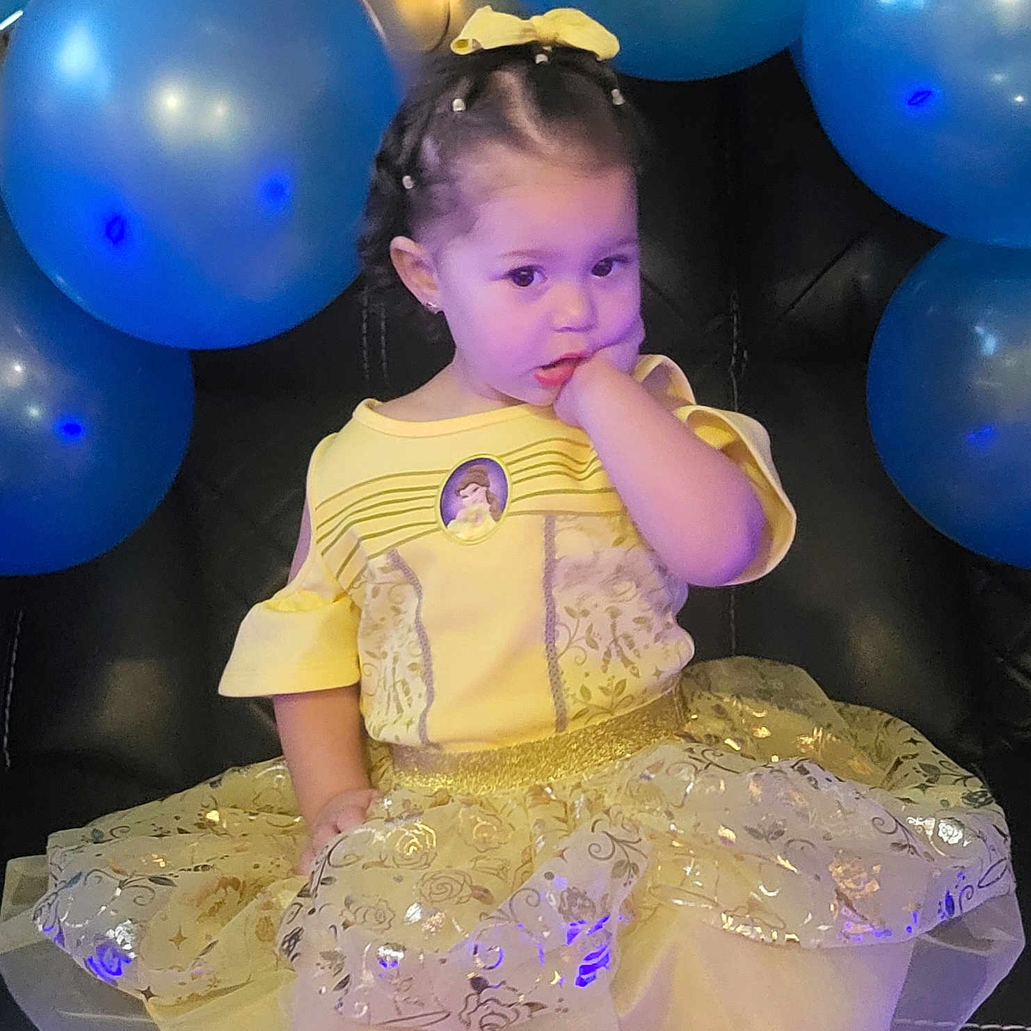 Leimy is registered to the contest to win money with this photo: accessories, balloon, child, clothing, costume, dress, eveningdress, face, female, formalwear, girl, head, performer, person, photography, portrait, purple, sitting, sleeve, soloperformance