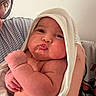 arm, baby, bath_time, closeup, cute, expression, face, glasses, hand, holding, indoor, infant, love, newborn, parent, person, pout, skin, striped_shirt, towel