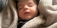 Lucas participe au concours pour gagner de l'argent avec cette photo : baby, blanket, child, closed_eyes, comfort, couch, cozy, fabric, face, head, indoors, infant, peaceful, portrait, resting, sleeping, soft, toddler, warm, wrapped