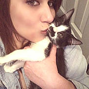 Butthead joined the competition — help win amazing prizes! woman, cat, affection, kiss, indoor, closeup, pet, love, black_and_white_cat, face, hand, door, casual_clothing, portrait, feline, holding, domestic_animal, human, warmth, cozy