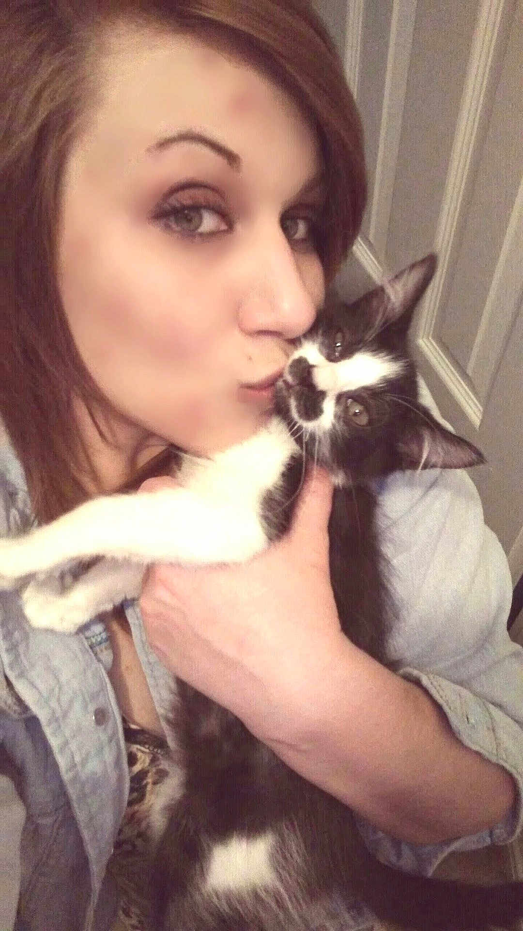 Butthead joined the competition — help win amazing prizes! woman, cat, affection, kiss, indoor, closeup, pet, love, black_and_white_cat, face, hand, door, casual_clothing, portrait, feline, holding, domestic_animal, human, warmth, cozy