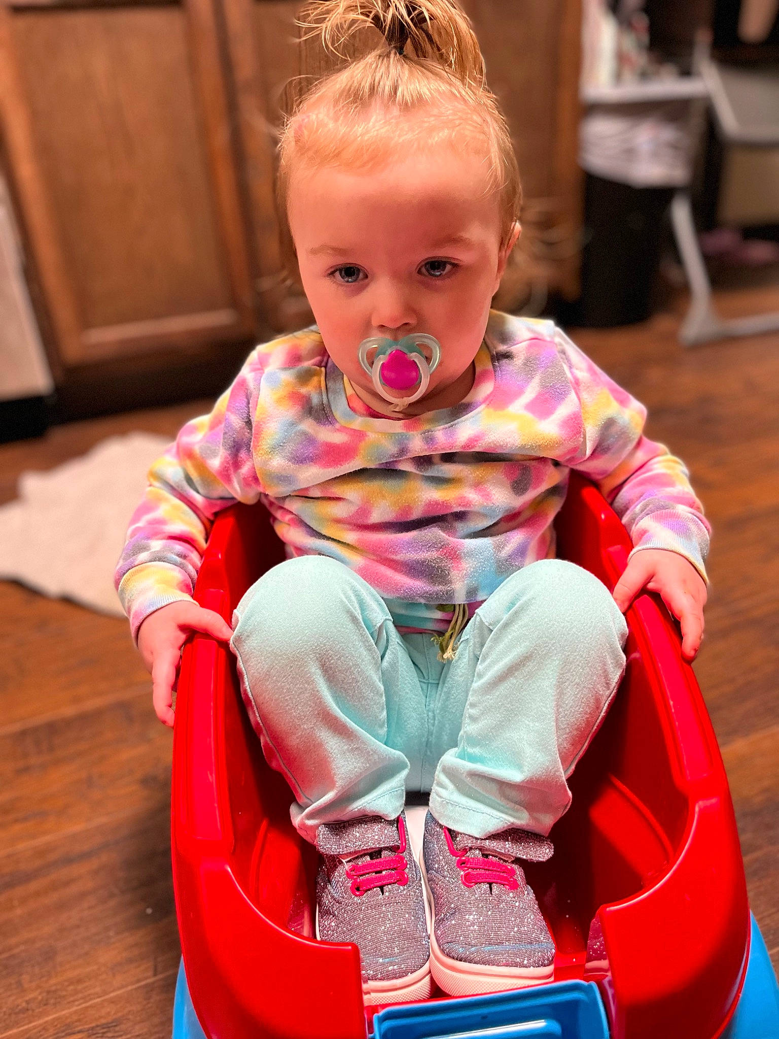 Makennah is registered to the contest to win money with this photo: baby, baby_products, baby_toddler_clothing, bumper, chair, cheek, child, child_model, flooring, fun, happy, hardwood, leisure, magenta, person, pink, play, portrait_photography, sitting, toddler