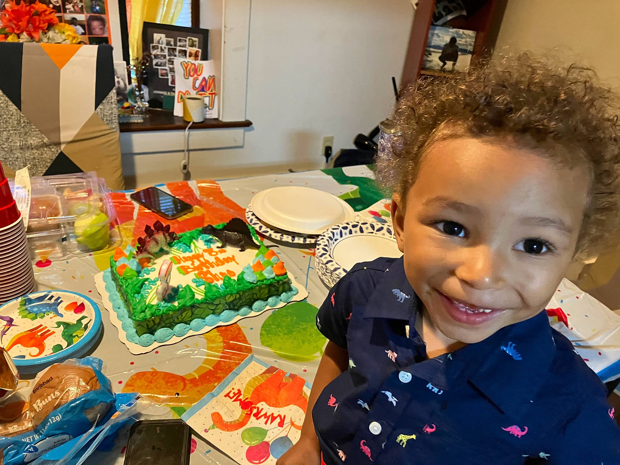 Deshae is registered to the contest to win money with this photo: baking, cake, chair, child, comfort_food, cooking, cuisine, dessert, dish, event, finger_food, food, ingredient, joy, person, picture_frame, plate, smile, sweetness, table