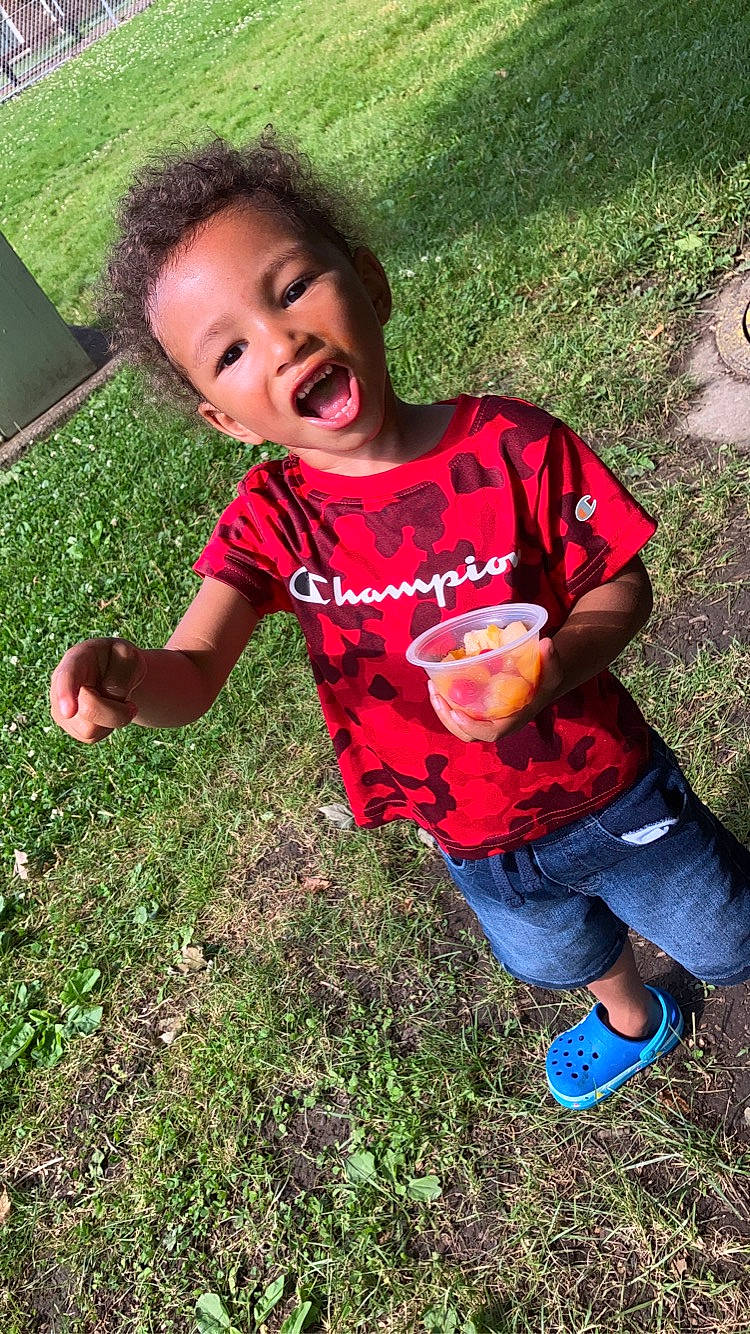 Deshae joined the competition — help win amazing prizes! child, fun, games, garden, grass, grassland, green, happy, lawn, leg, leisure, people_in_nature, person, plant, play, recreation, sitting, soil, t_shirt, toddler