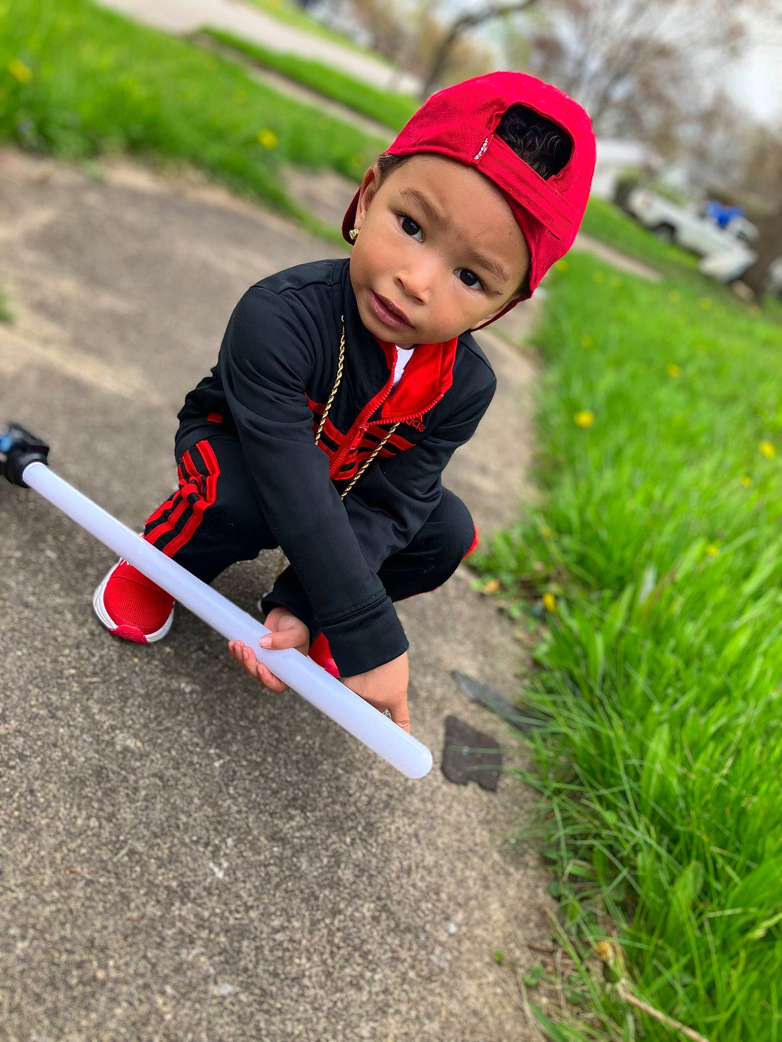 Deshae joined the competition — help win amazing prizes! baby, cap, child, competition_event, fun, grass, hat, headwear, landscape, leisure, outdoor_play_equipment, people_in_nature, person, personal_protective_equipment, plant, play, recreation, sneakers, sports, toddler