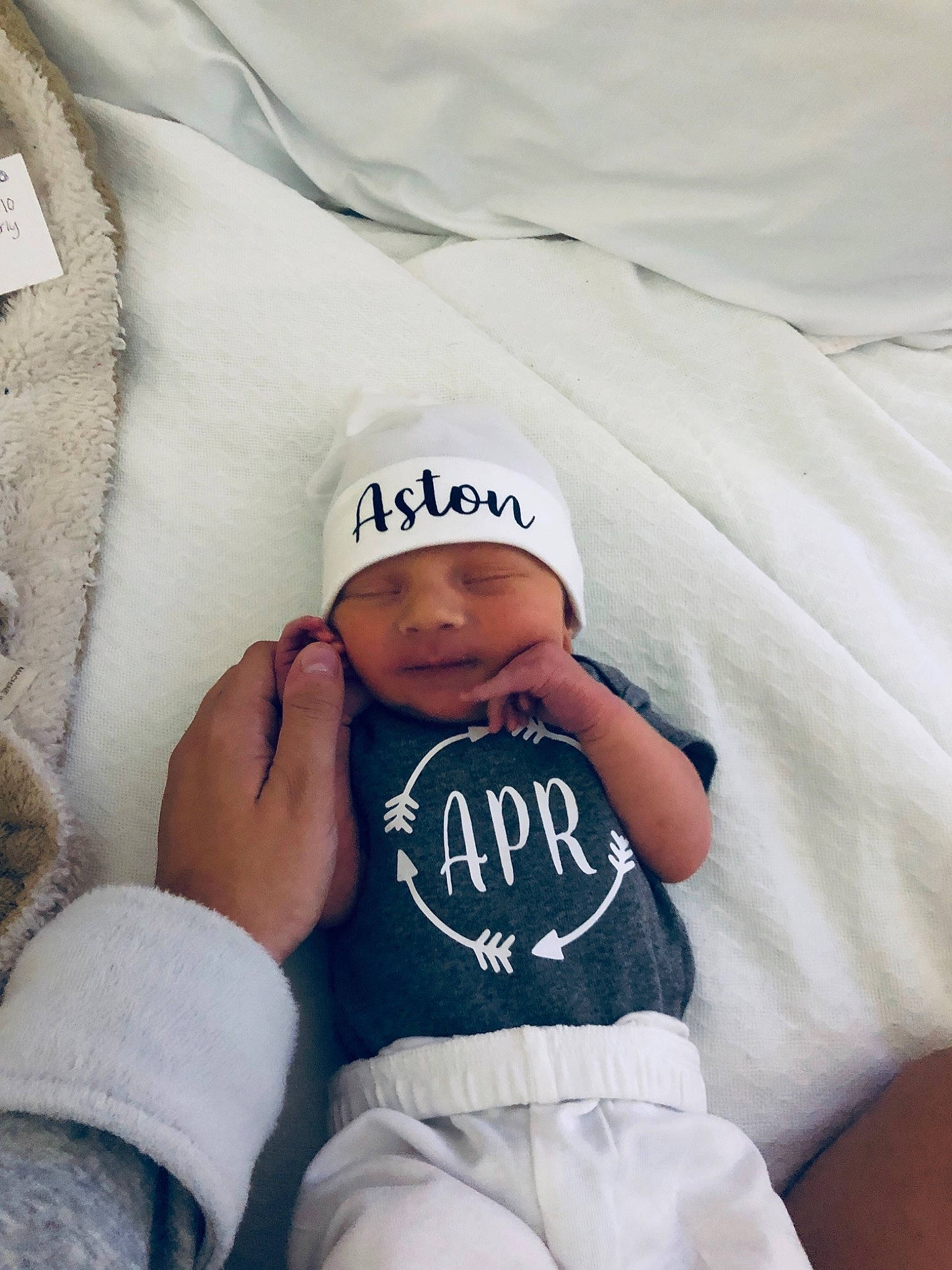 Aston joined the competition — help win amazing prizes! baby, beanie, child, cool, headgear, headwear, linens, person, product, t_shirt, textile