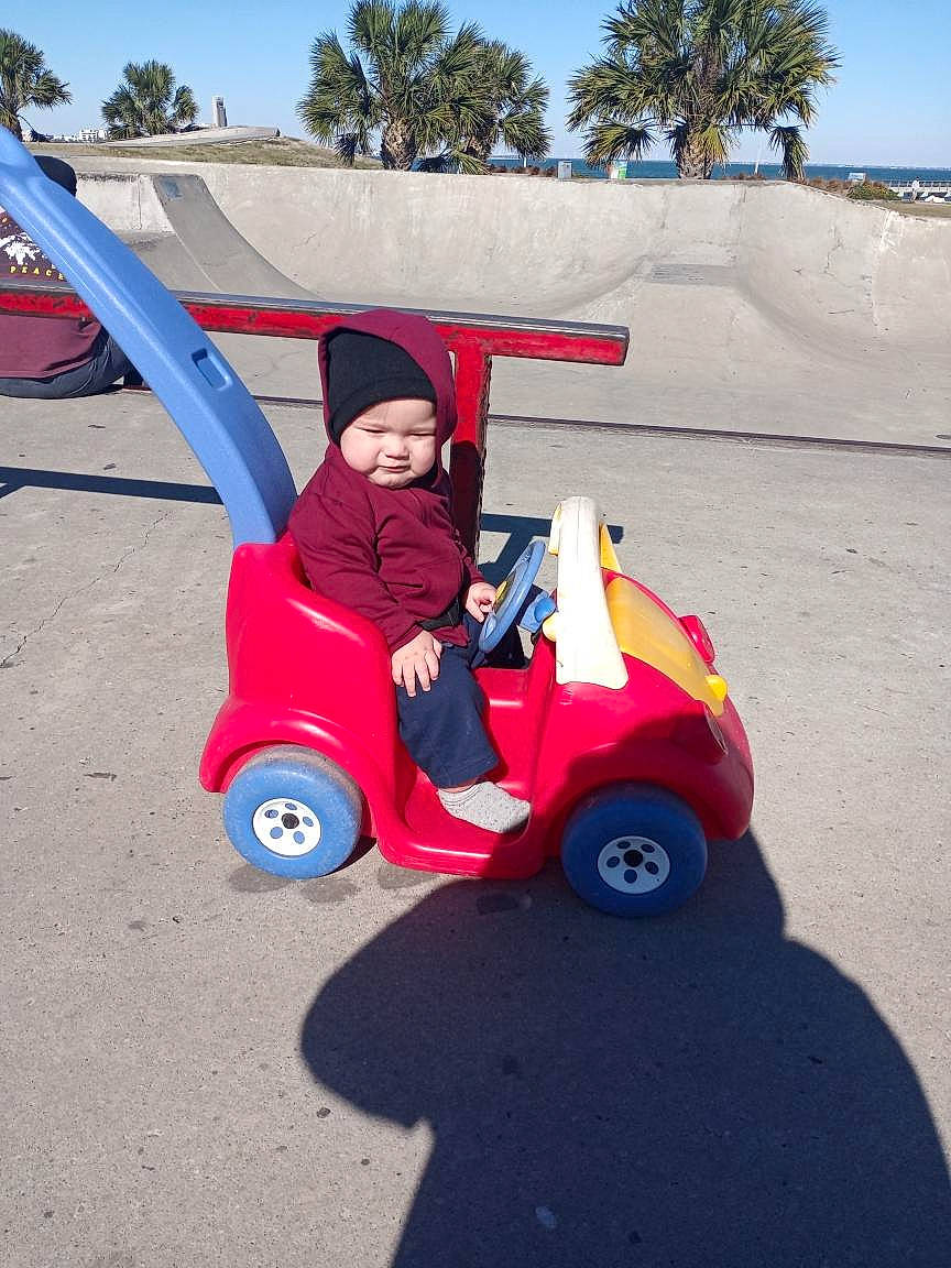 Jovanni joined the competition — help win amazing prizes! driving, electric_blue, headwear, person, play, riding_toy, rolling, tire, toy_vehicle, tread, wheel