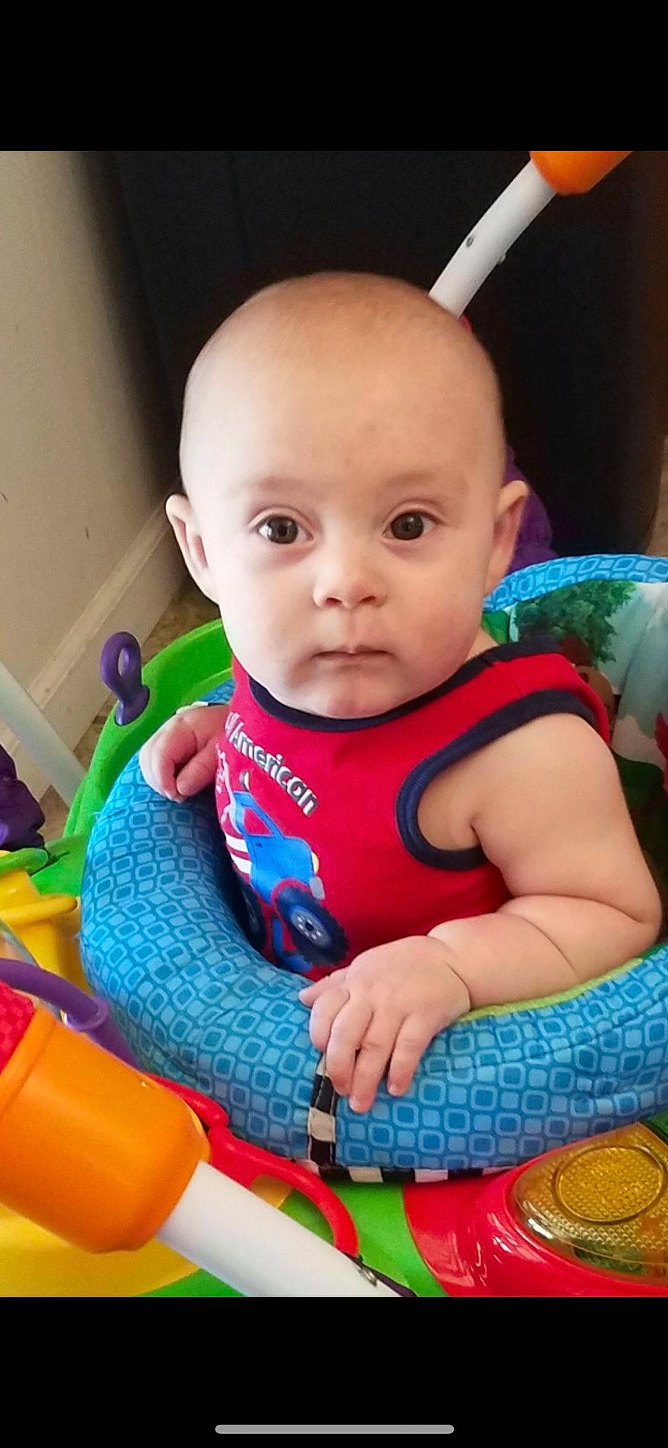 Channing is registered to the contest to win money with this photo: baby, baby_carriage, baby_playing_with_toys, baby_products, baby_safety, baby_toddler_clothing, cheek, child, clothing, electric_blue, eyelash, finger, fun, happy, iris, person, product, skin, sleeve, smile