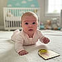 baby, infant, pink_onesie, blanket, crib, nursery, stuffed_toys, milestone_card, two_months, face, wide_eyes, soft_lighting, indoor, cute, child, portrait, lying_down, white, cozy, home