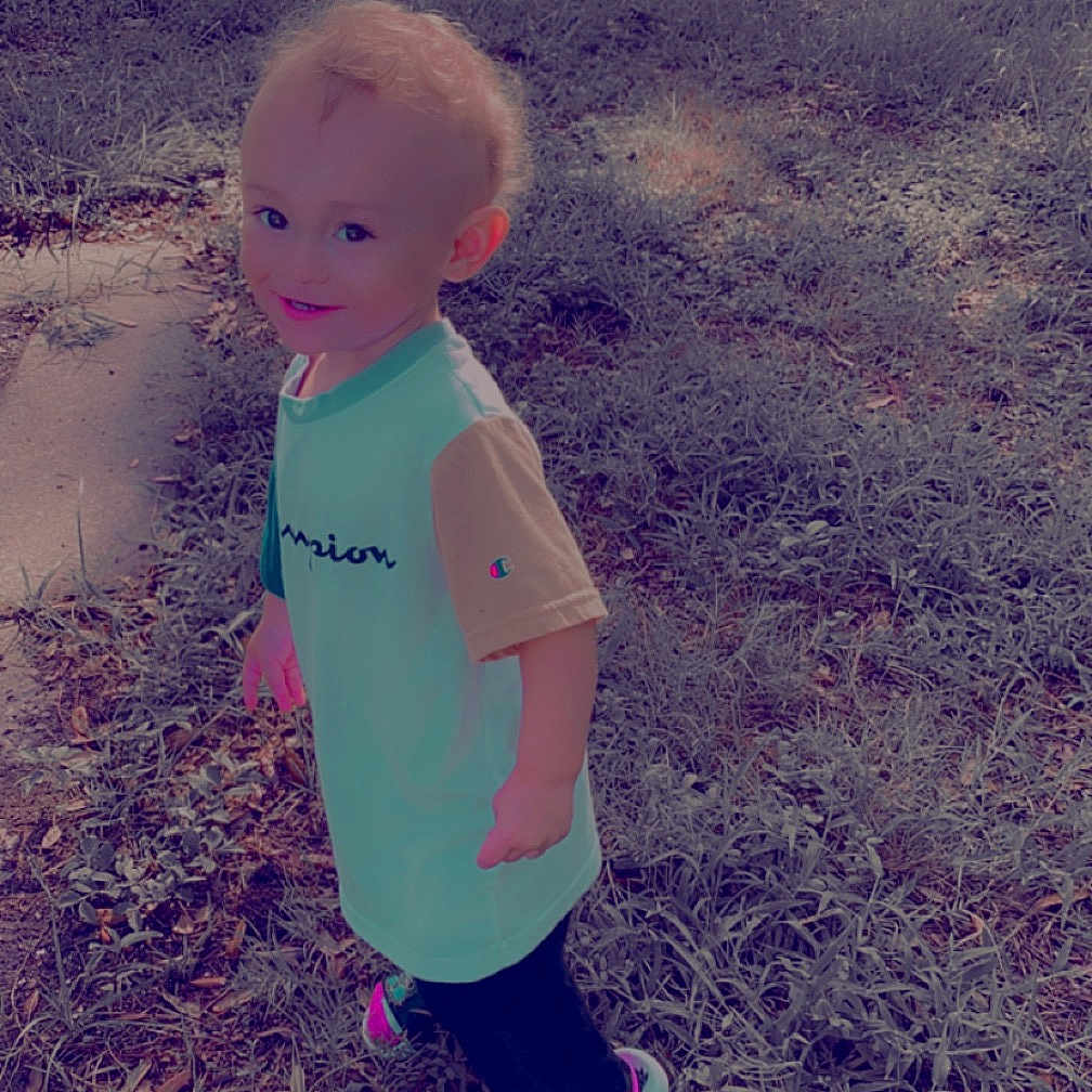 Ryland is registered to the contest to win money with this photo: art, asphalt, baby, baby_toddler_clothing, child, fun, grass, grassland, happy, landscape, people_in_nature, play, sand, shadow, sitting, soil, standing, tints_and_shades, toddler, walking