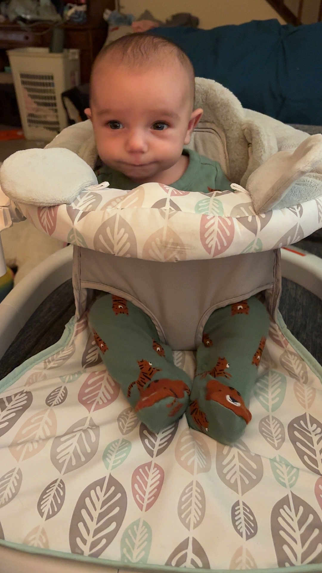 Rory joined the competition — help win amazing prizes! baby, infant, child, pajamas, tiger_print, baby_seat, cushion, blanket, indoor, soft_lighting, face, expression, cute, sitting, footwear, pattern, home, comfort, person, young