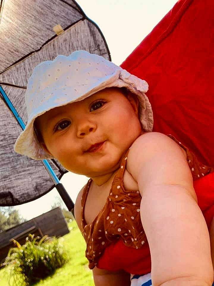 Lyana participe au concours pour gagner de l'argent avec cette photo : beauty, blue, cap, child, fashion_accessory, fun, happy, hat, headgear, headwear, leisure, lip, people_in_nature, person, plant, skin, smile, summer, sun_hat, swimwear
