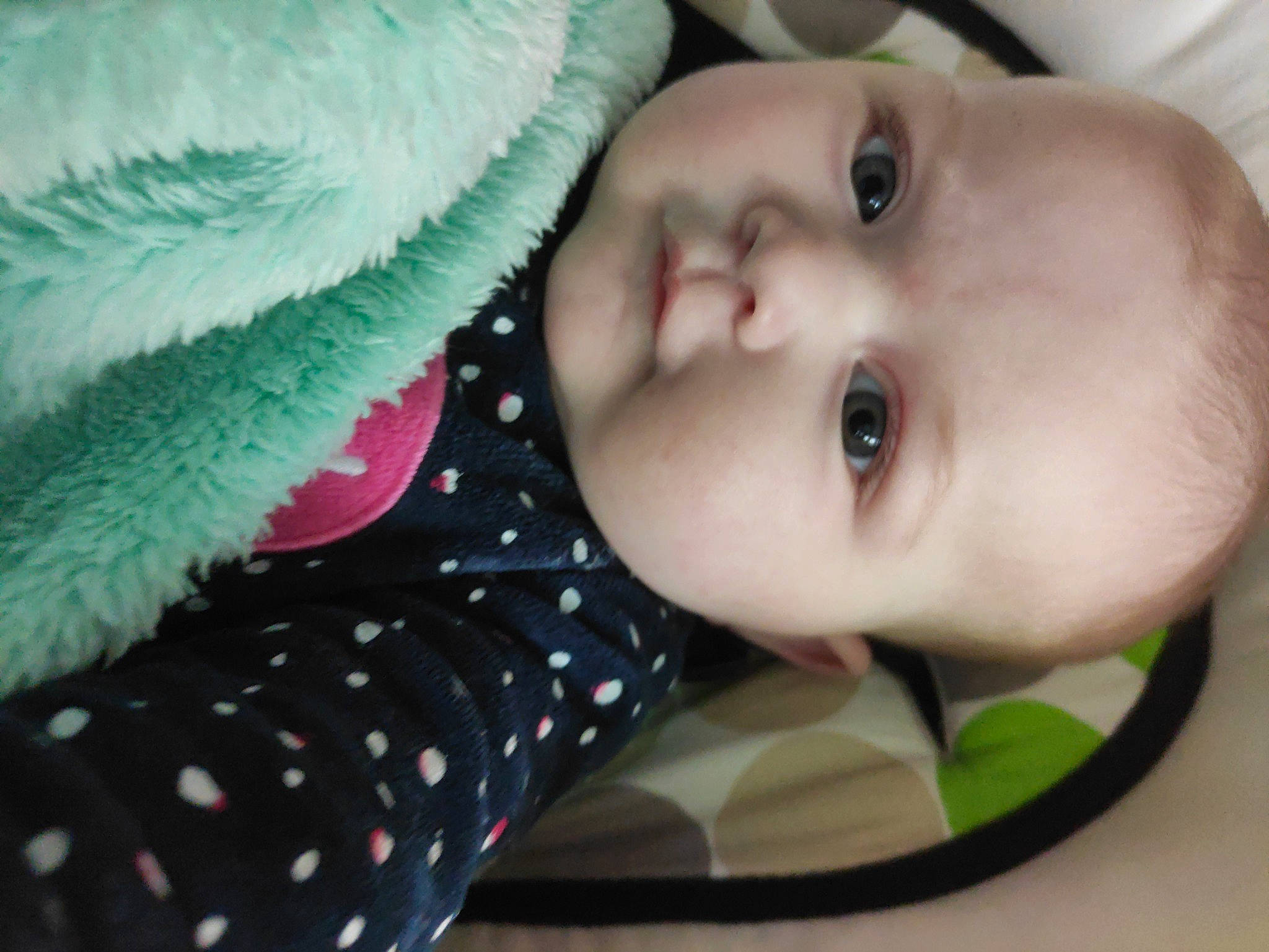 Marie participe au concours pour gagner de l'argent avec cette photo : baby, baby_products, baby_toddler_clothing, cheek, child, close_up, eyebrow, eyelash, grass, happy, linens, lip, nose, pattern, person, skin, sleeve, smile, terrestrial_plant, textile