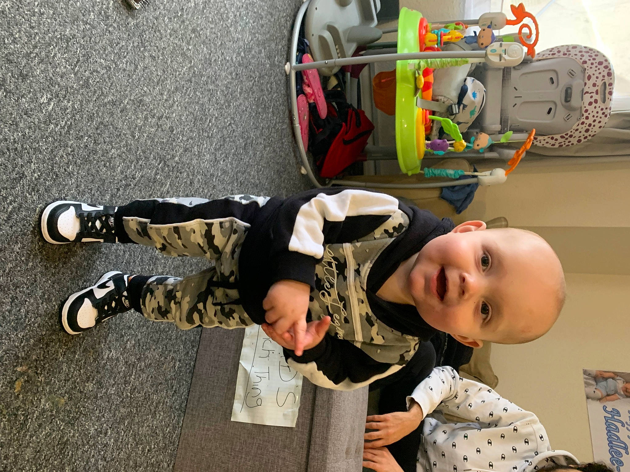Hadlee-joe is registered to the contest to win money with this photo: asphalt, automotive_design, automotive_tire, baby, child, fun, happy, motor_vehicle, outdoor_shoe, person, personal_protective_equipment, play, shoe, smile, sneakers, t_shirt, tire, toddler, vehicle, walking_shoe