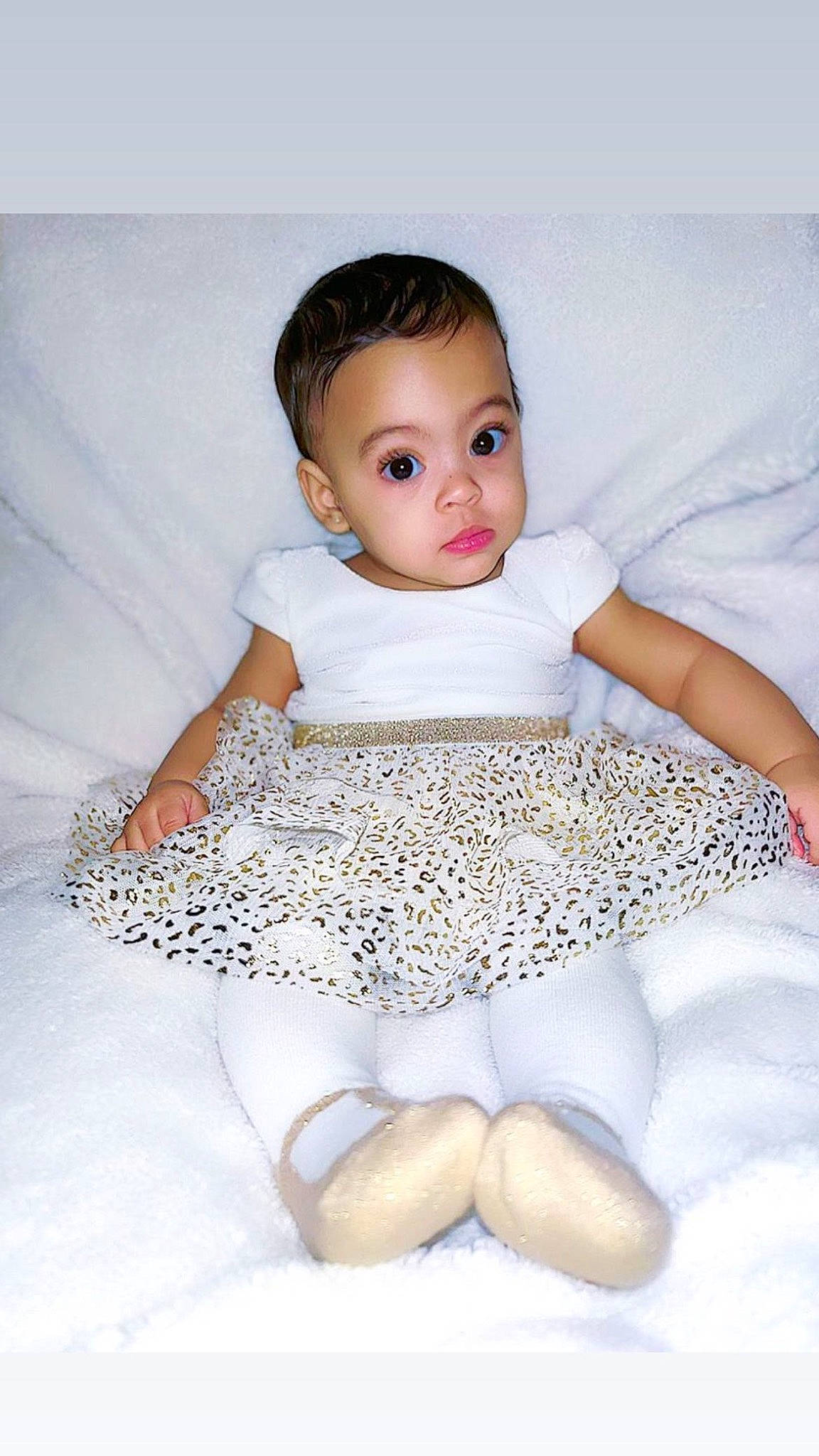 Evangeline is registered to the contest to win money with this photo: abdomen, arm, baby, baby_toddler_clothing, comfort, eye, flash_photography, happy, human_leg, iris, knee, neck, pattern, person, skin, sleeve, stomach, textile, thigh, toddler