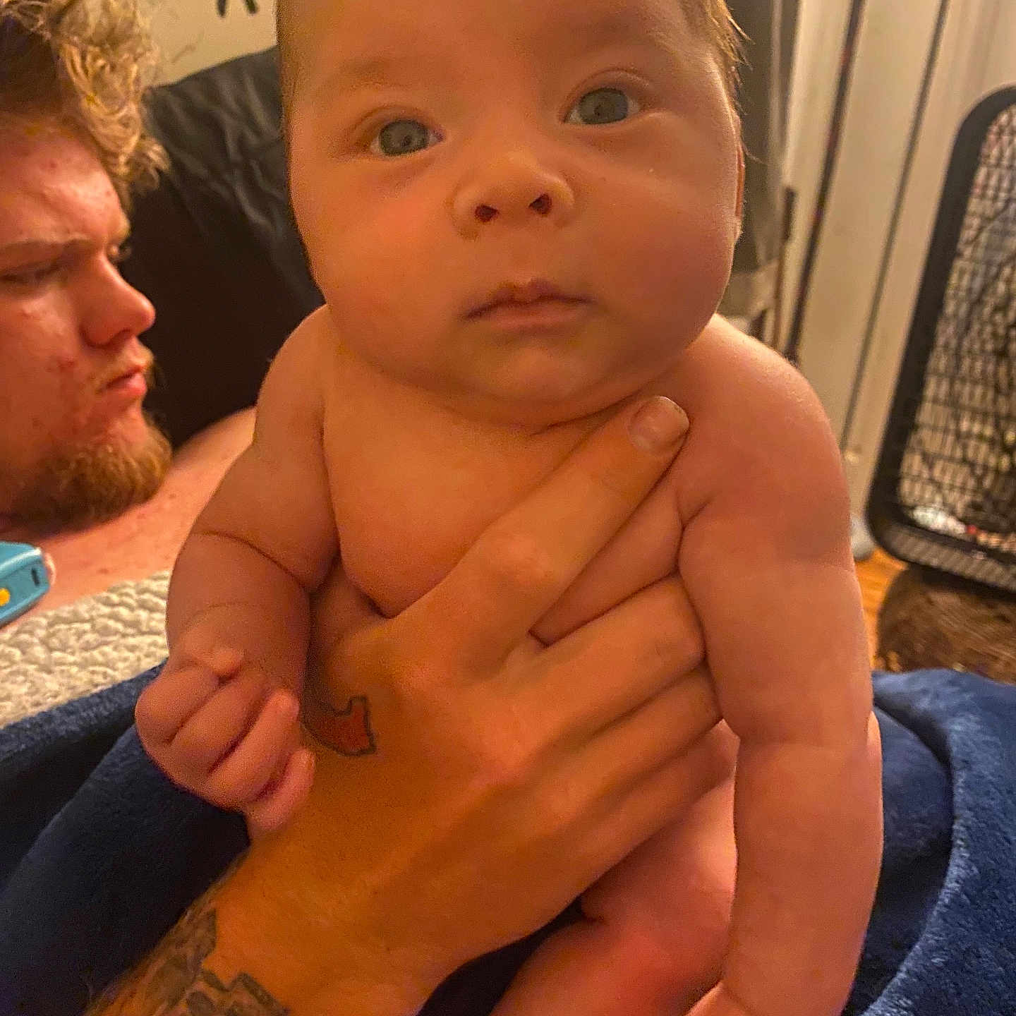Jesco is registered to the contest to win money with this photo: adult, arm, baby, bodypart, face, finger, hand, head, male, man, newborn, people, person, photography, portrait, shoulder, sitting, skin, tattoo, wrist