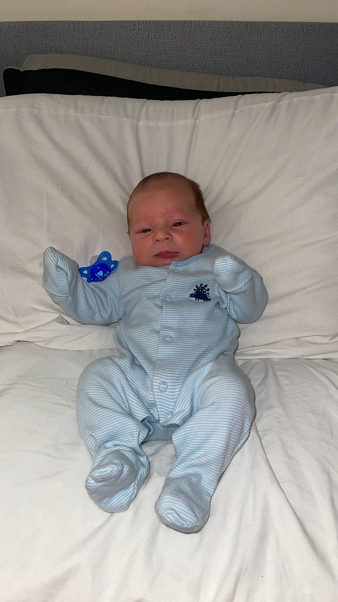 Brodie joined the competition — help win amazing prizes! baby, baby_toddler_clothing, child, comfort, eye, face, flooring, foot, head, iris, linens, person, room, sitting, sleeve, smile, toddler