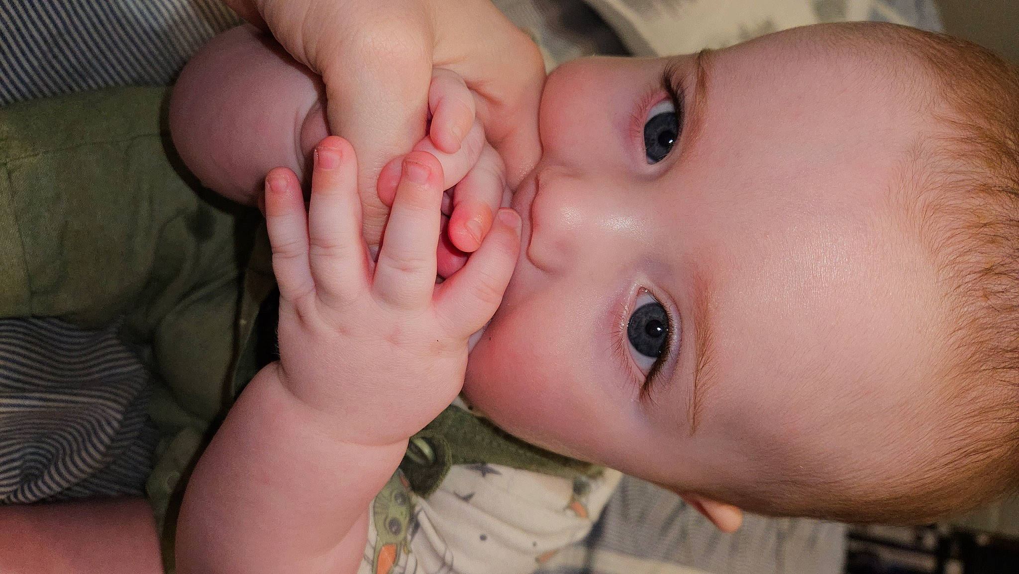 Alexander is registered to the contest to win money with this photo: baby, cheek, chin, ear, eye, eyebrow, eyelash, facial_expression, finger, gesture, hand, human, iris, lip, mammal, mouth, nail, neck, nose, person